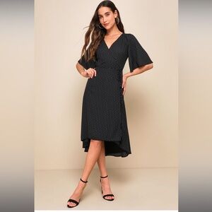 Black with polka dot print, wrap dress.  NWT Size Medium.